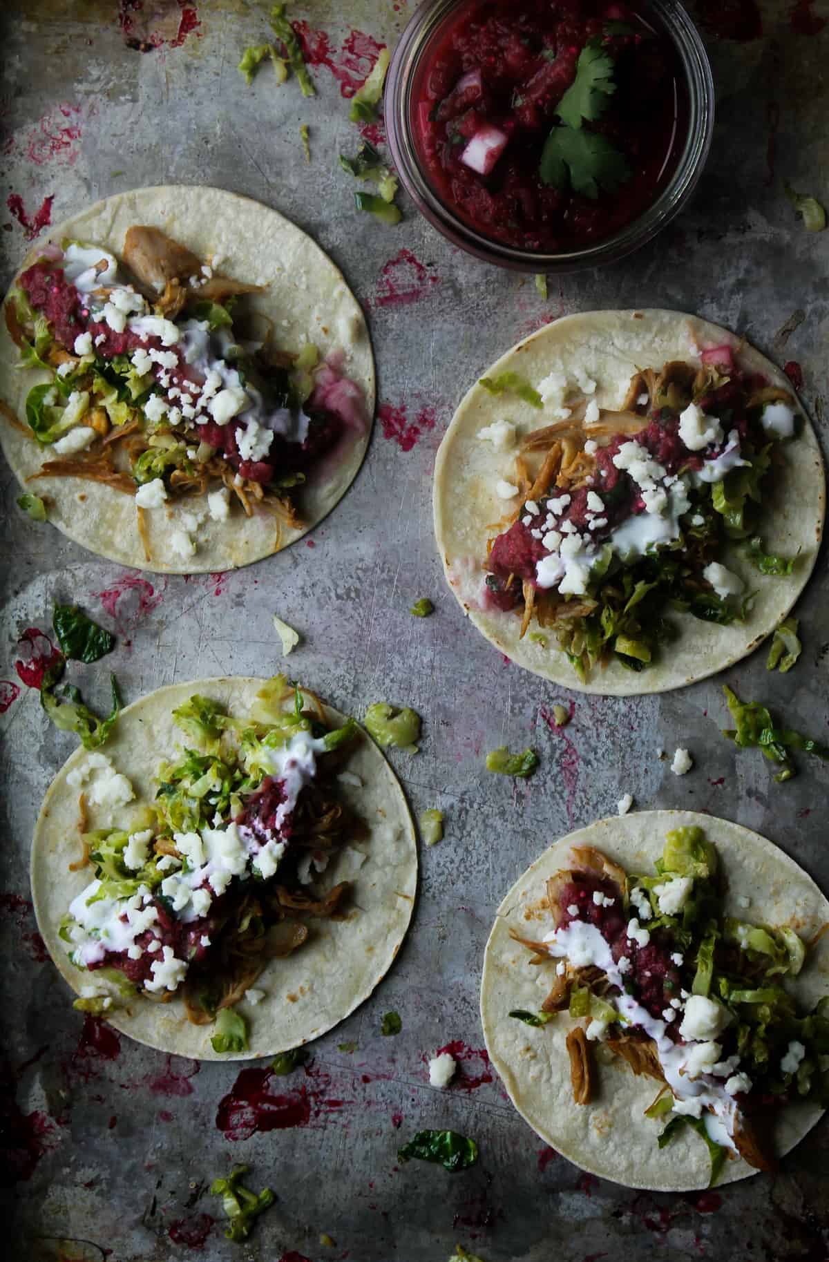 four leftover turkey tacos with side of cranberry salsa