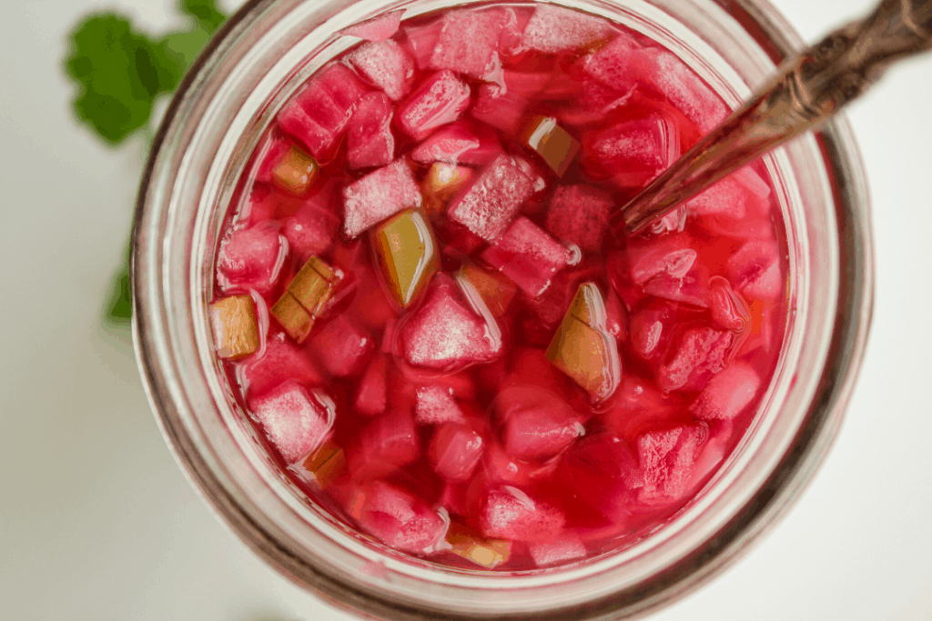 pickled red onion and jalapeno in jar with spoon