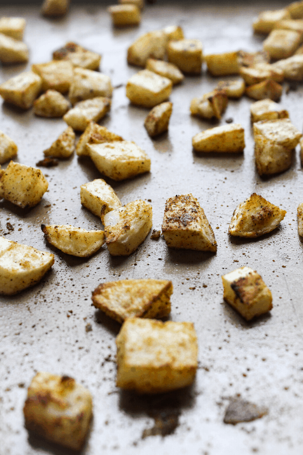 roasted cubed potatoes on sheet pan 
