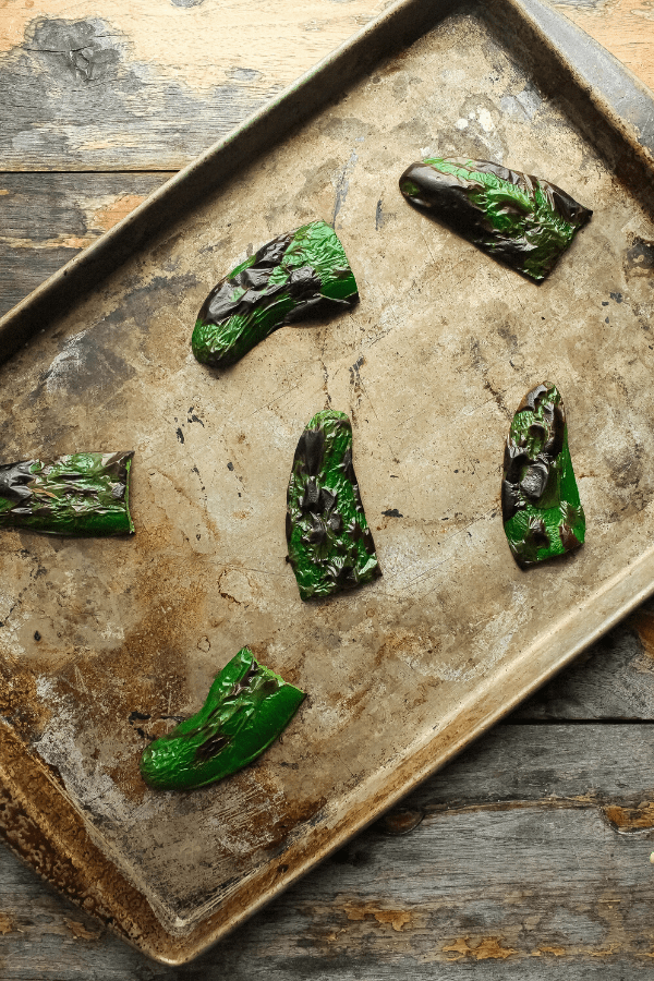 broiled jalapeno slices on sheet pan from above 