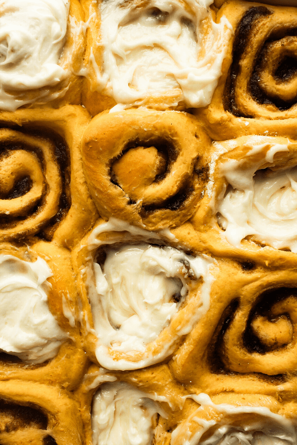 close up of pumpkin cinnamon rolls with chai spice from above