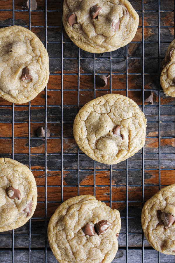 Close-up of chocolate chip cookies on wire cooling rack shot from above. 