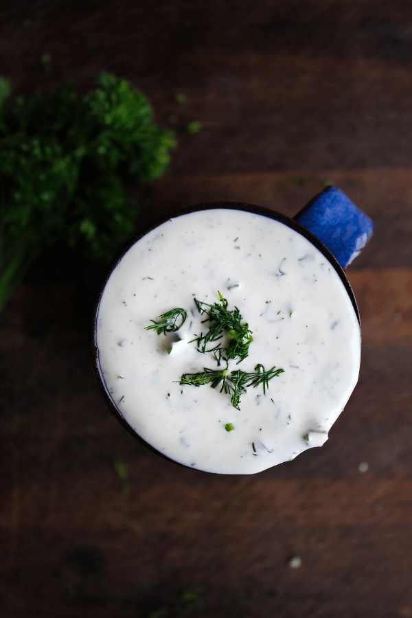 Shot of ranch sprinkled with fresh dill shot from above. 