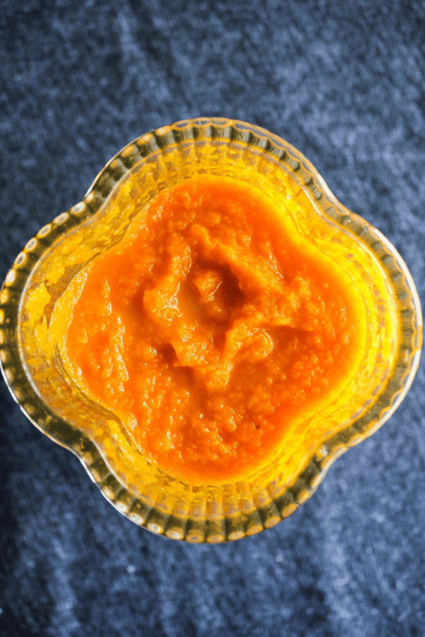 Carrot mixture in blender shot from above. 