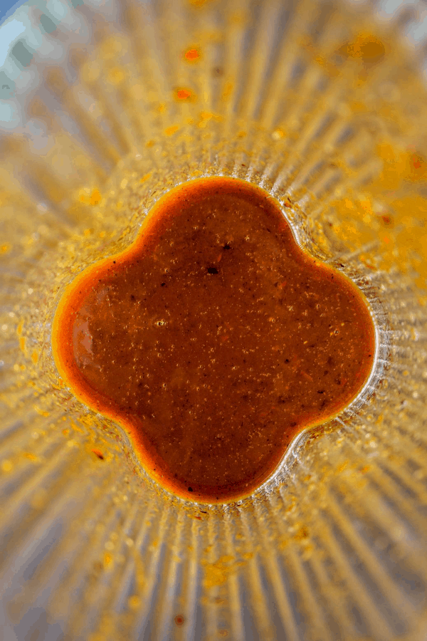 Top down shot of hot sauce in blender. 
