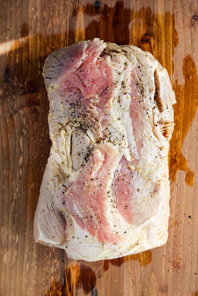 Brined pork loin smothered in black pepper.