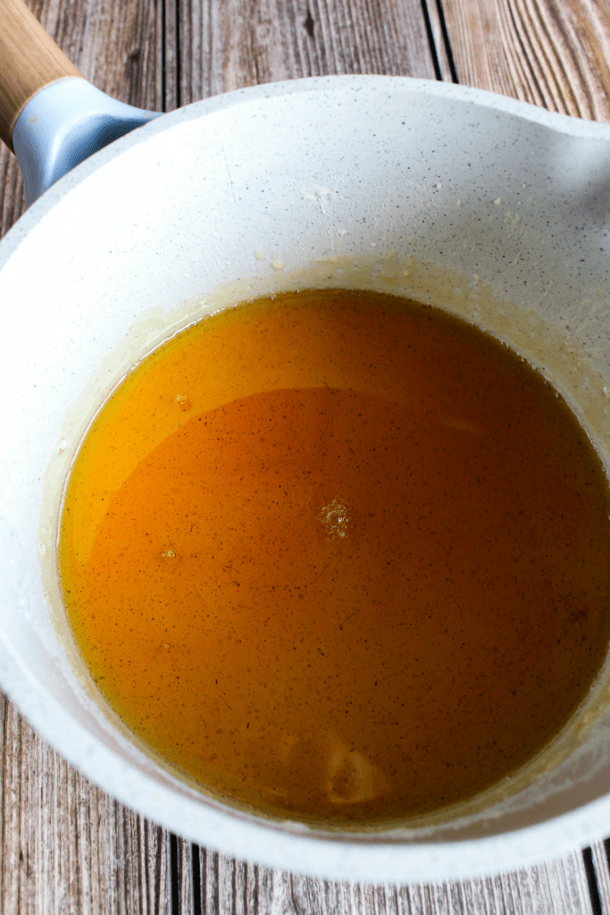 Close up shot of amber colored sugar water.