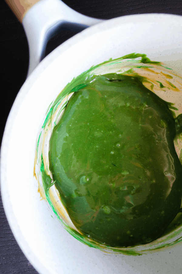 Green caramel in a saucepan.