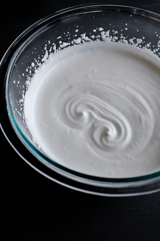 Soft peaks in whipped cream.