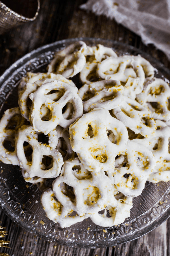 Top down shot of pile of white chocolate covered pretzels.