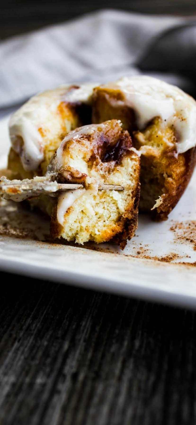 Close up of cut into cinnamon roll.
