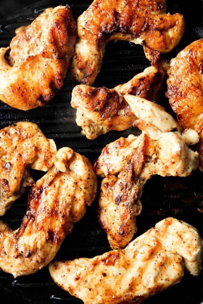 Grilled chicken in pan.