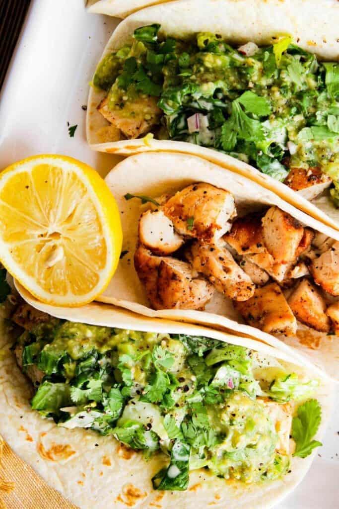 Close up of chipotle chicken Caesar tacos.