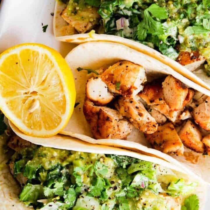 Close up of chipotle chicken Caesar tacos.