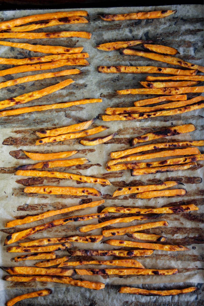 Baked fries on a sheet pan.
