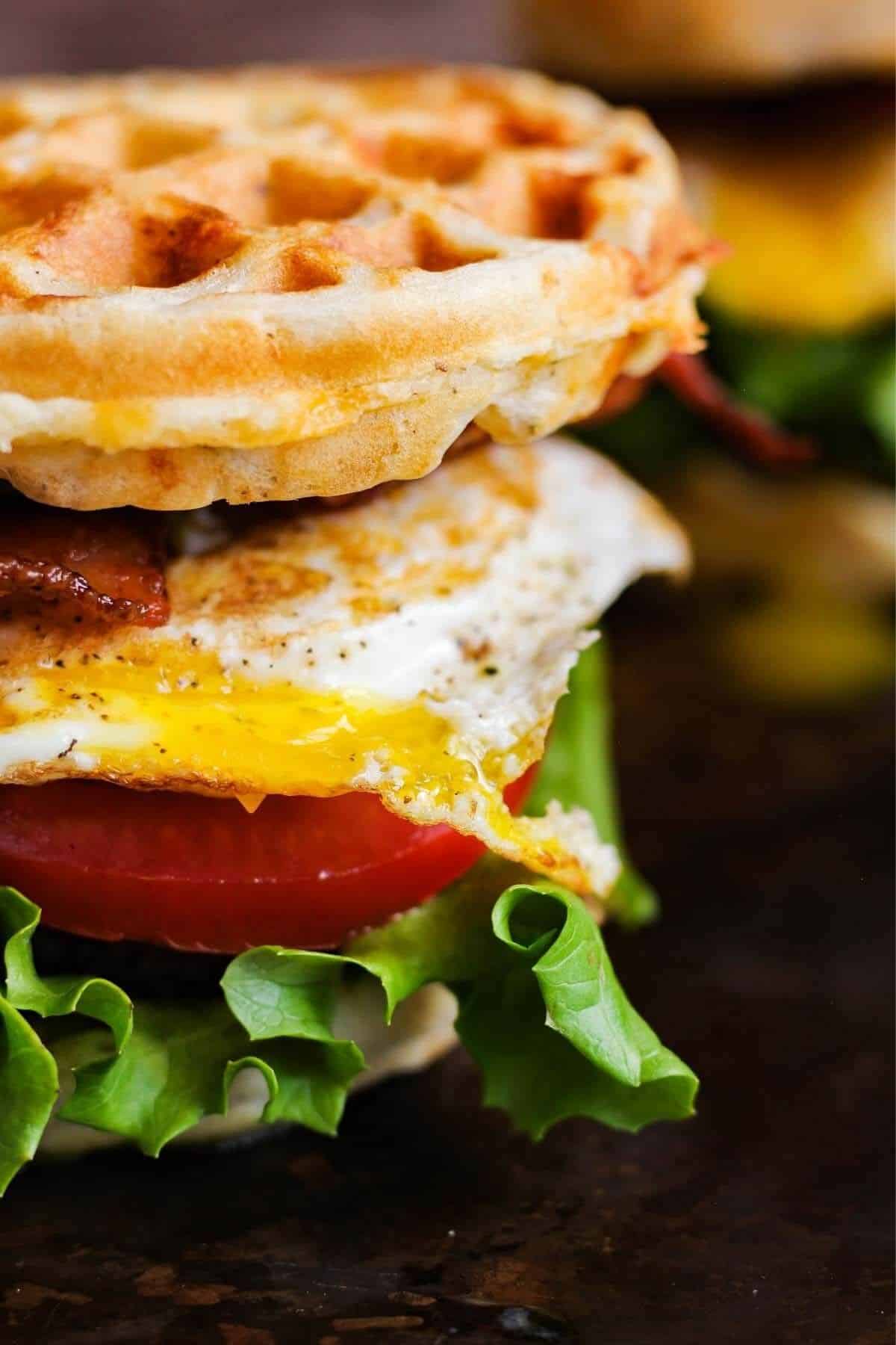Close up of breakfast waffle sandwich.