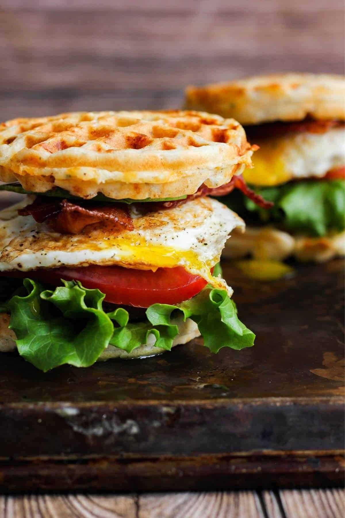 Two breakfast sandwiches on a sheet pan.