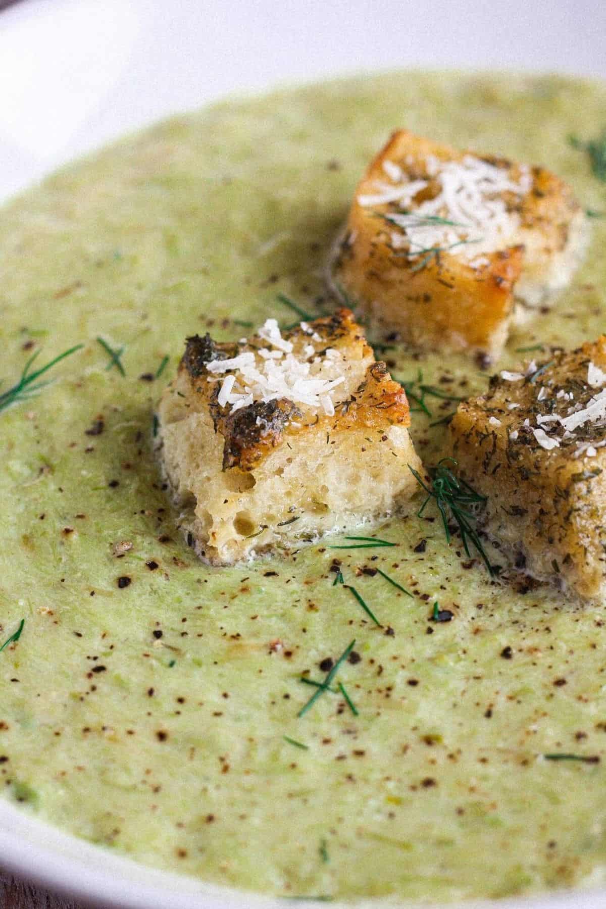 Close-up of soup with sourdough garlic bread croutons.