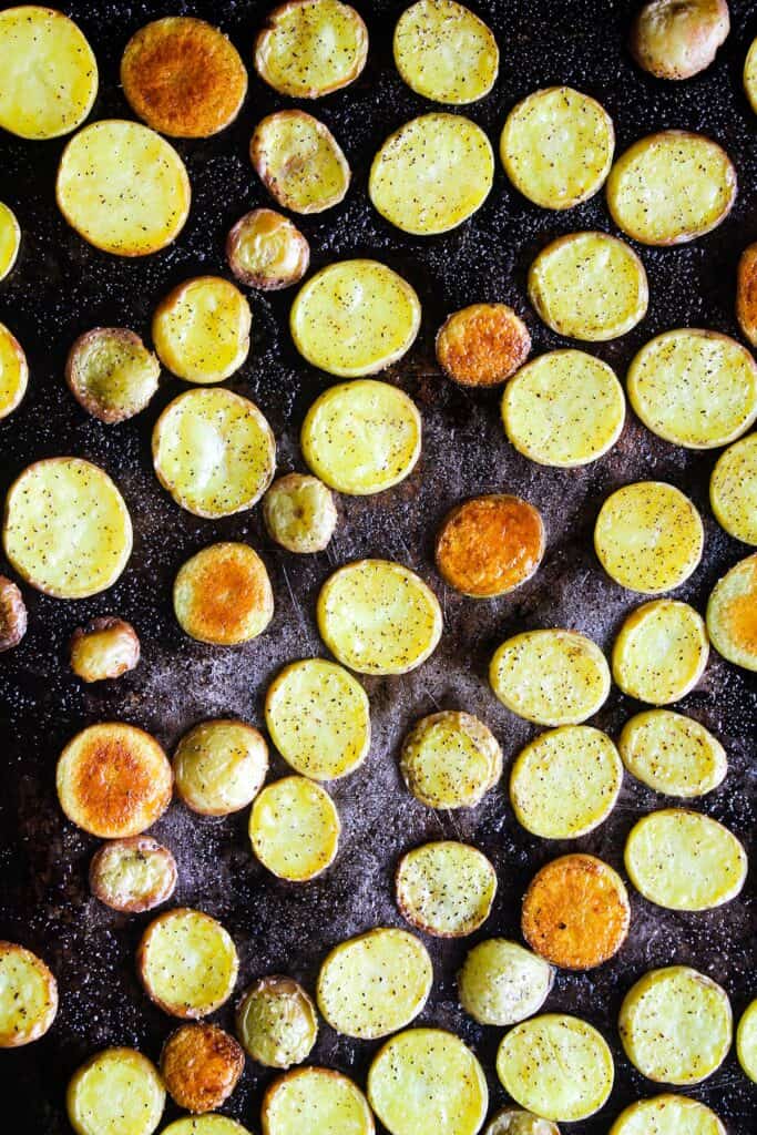 Roasted potatoes on a sheet pan.