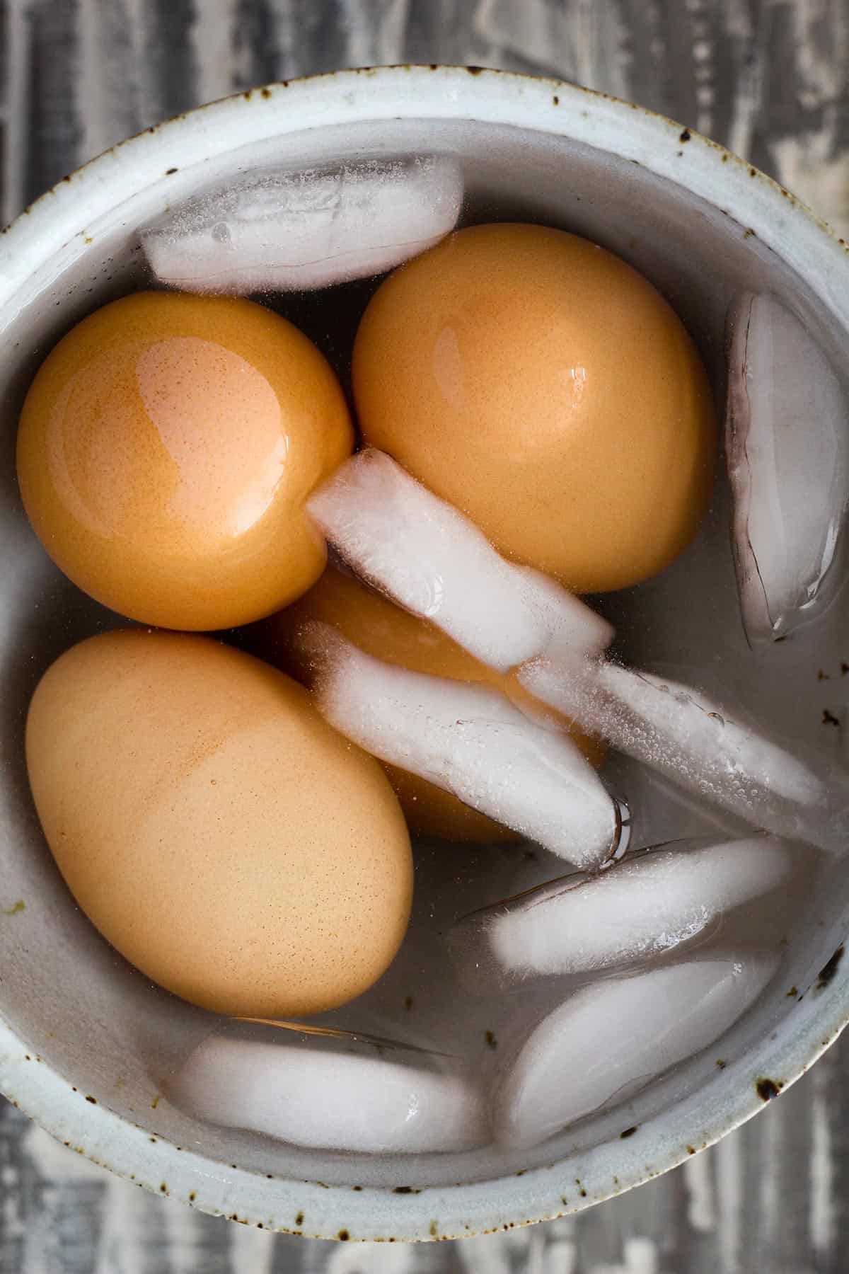 Boiled eggs in ice bath.