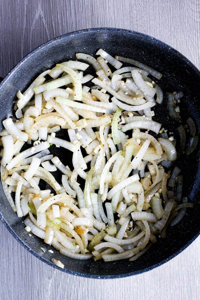 Sauteed onions in pan.
