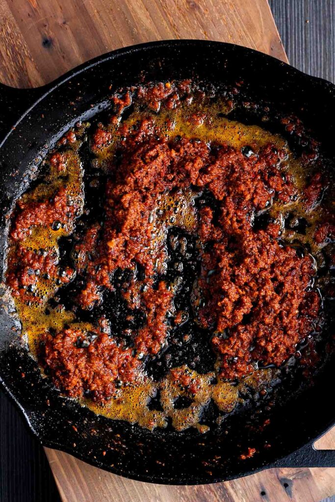Cooked chorizo in a skillet.