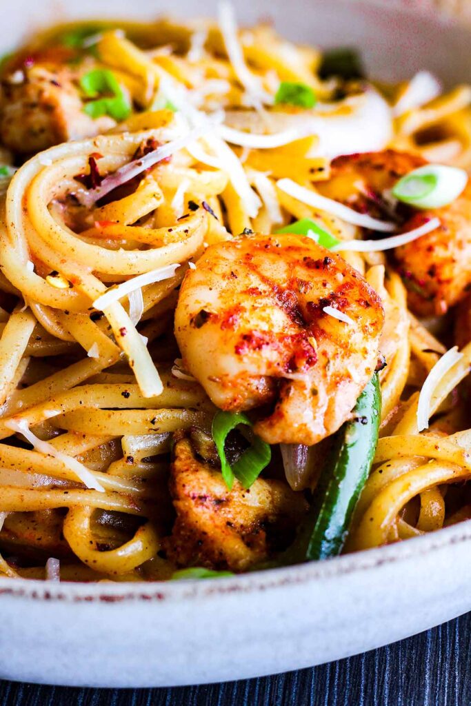 Close-up of cajun shrimp and chicken pasta.