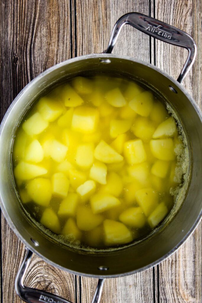 Boiled potatoes in a stock pot.