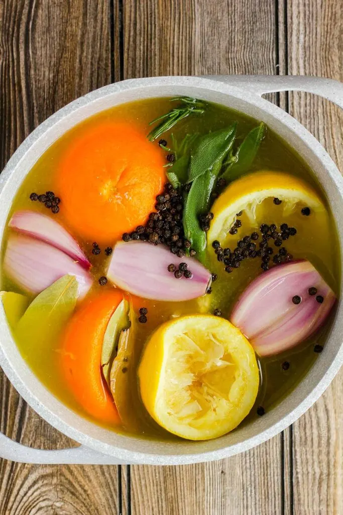 Orange brine before boiling in a saucepan.