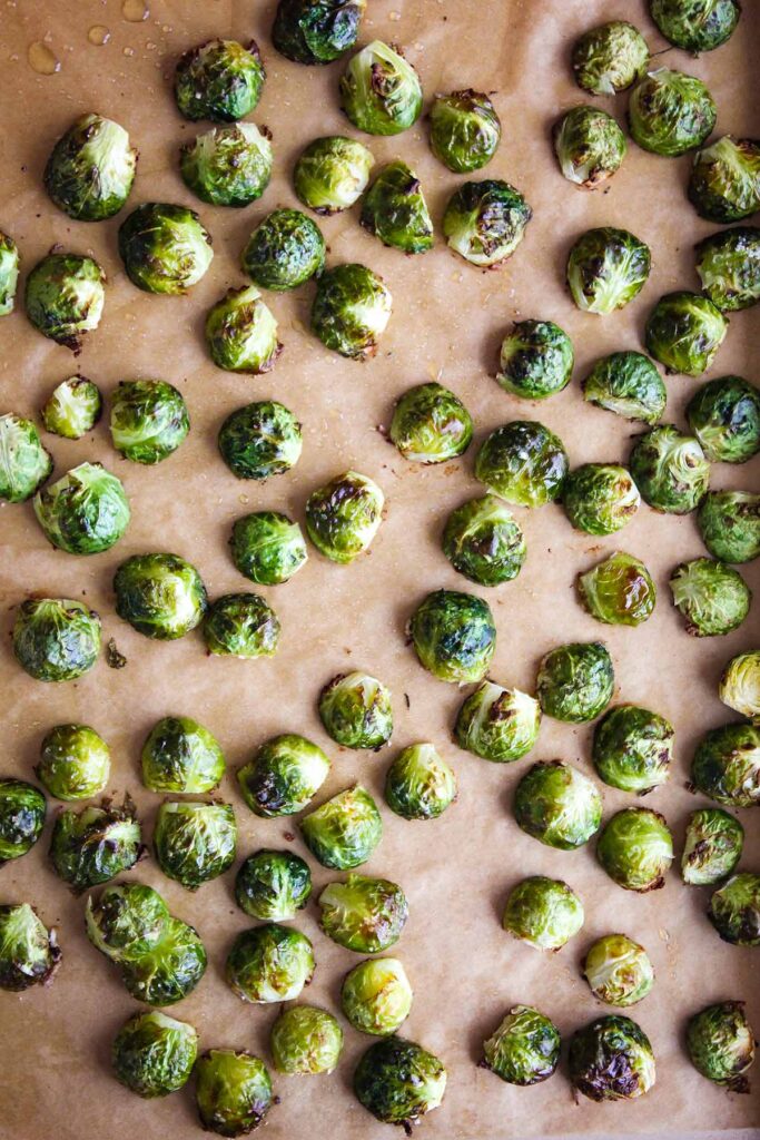 Roasted Brussels sprouts on a baking sheet.