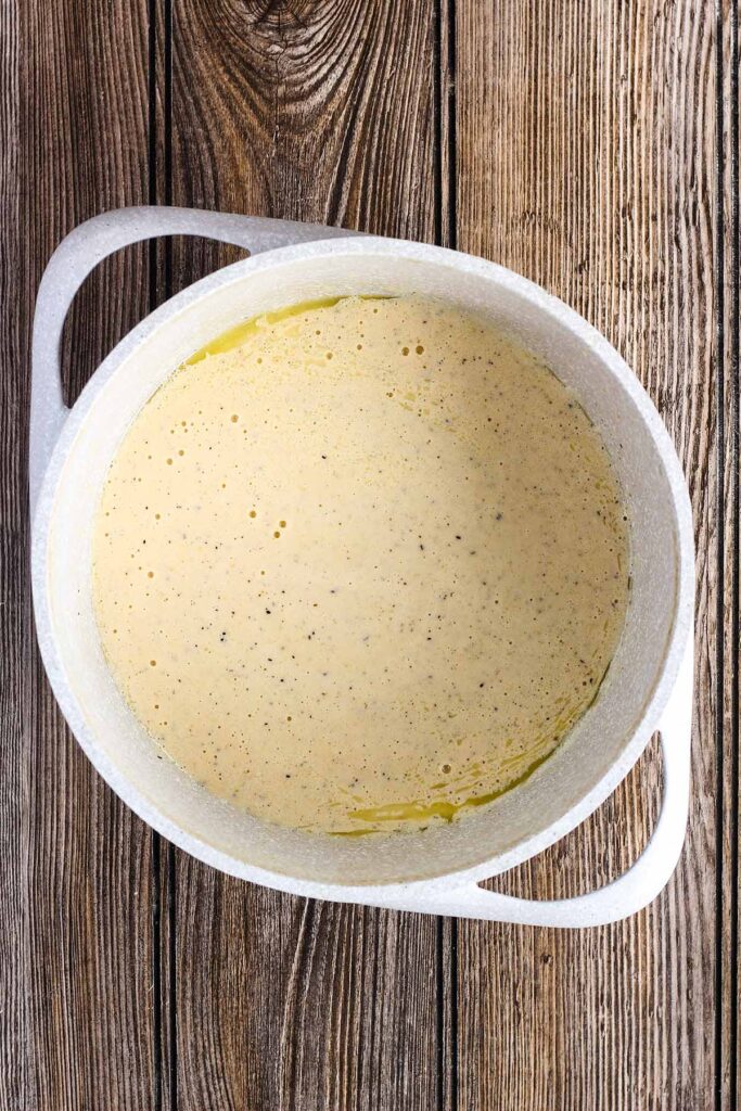 Buttermilk, butter, and sour cream mixture in a saucepan.