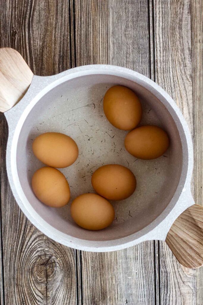 Boiled eggs in a saucepan.