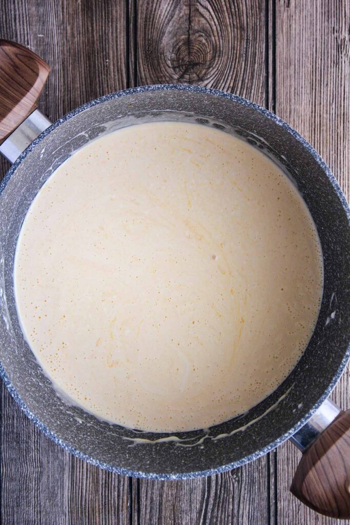 Cheese sauce in a large pot.