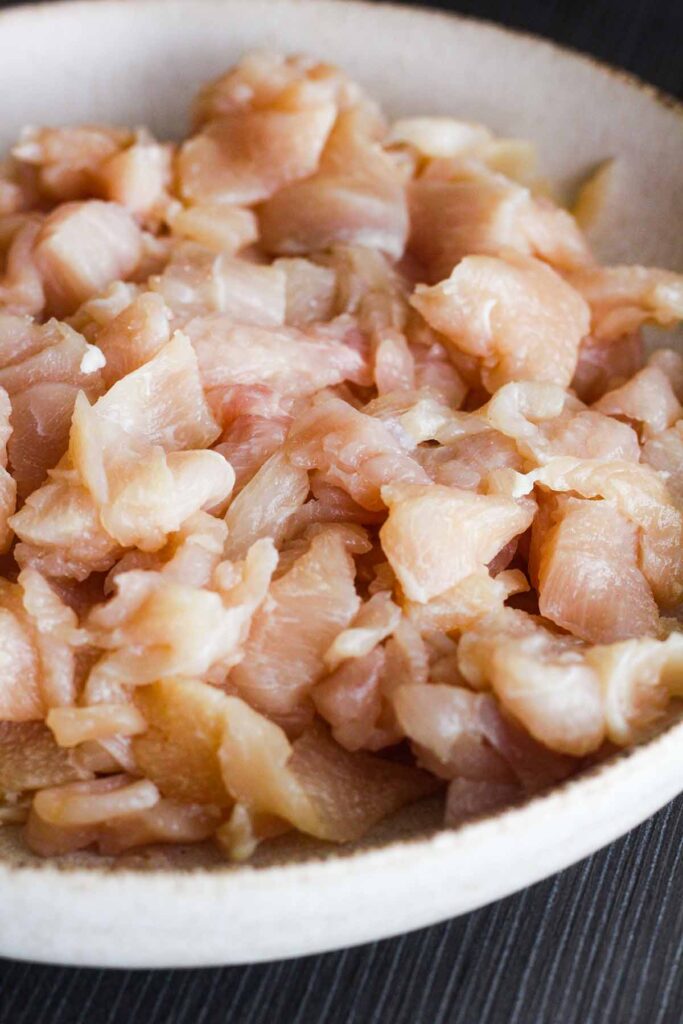 Chopped raw chicken in a bowl