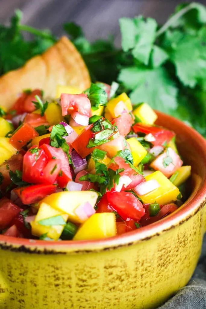 Close up of bowl of mango pico