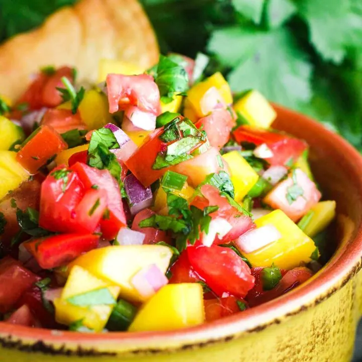 Close up of bowl of mango pico