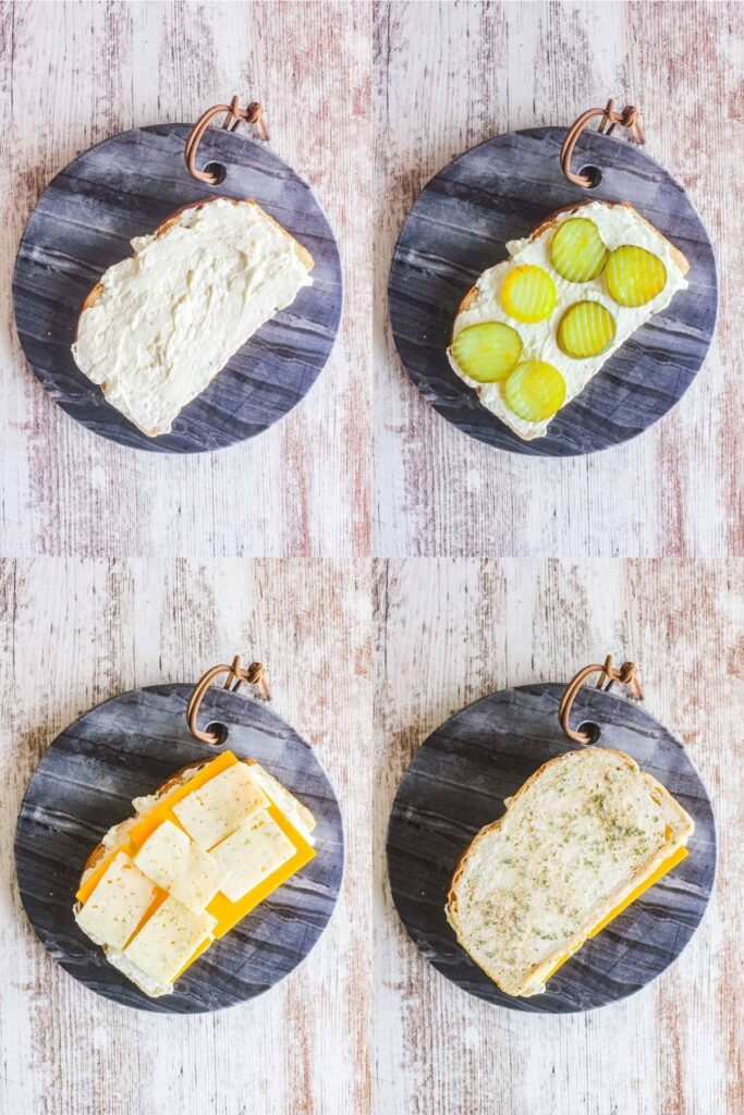 Four stages on sandwich assembly - with cream cheese, then pickles, then cheese, then top bread.