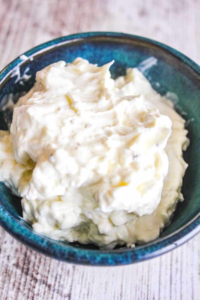 Ranch cream cheese in a small blue bowl.
