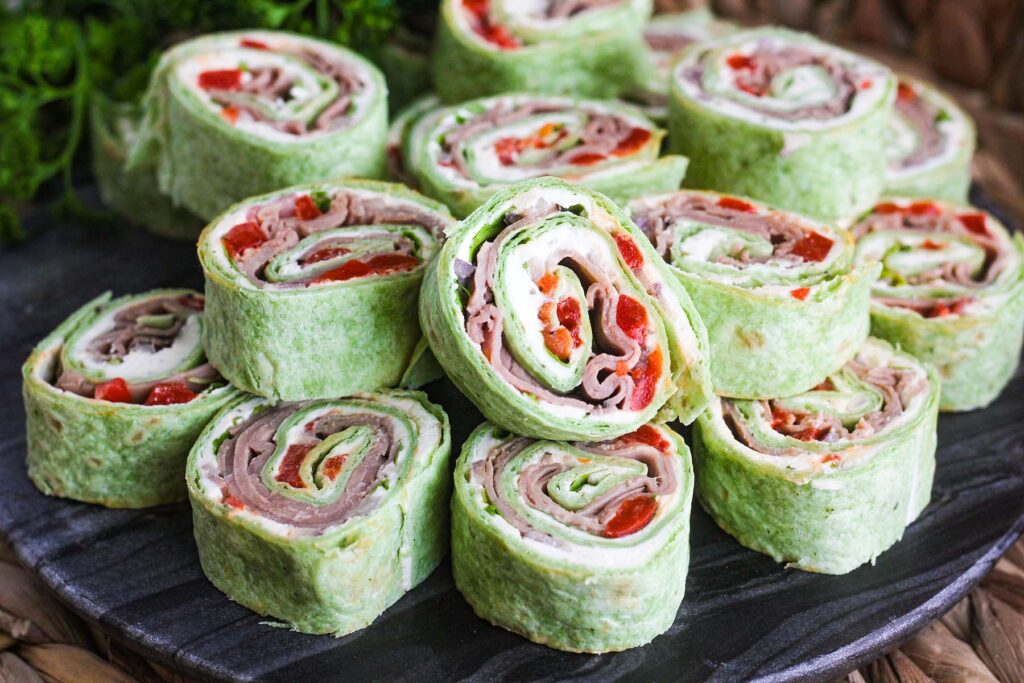 Close up of tray of Boursin cheese roast beef pinwheels.