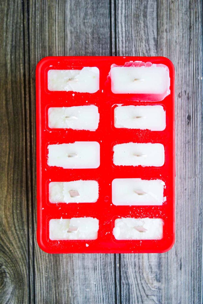 Homemade popsicles in red mold.